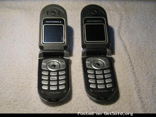 Two Motorola (model V180S) cellphones w/ cases and one charger